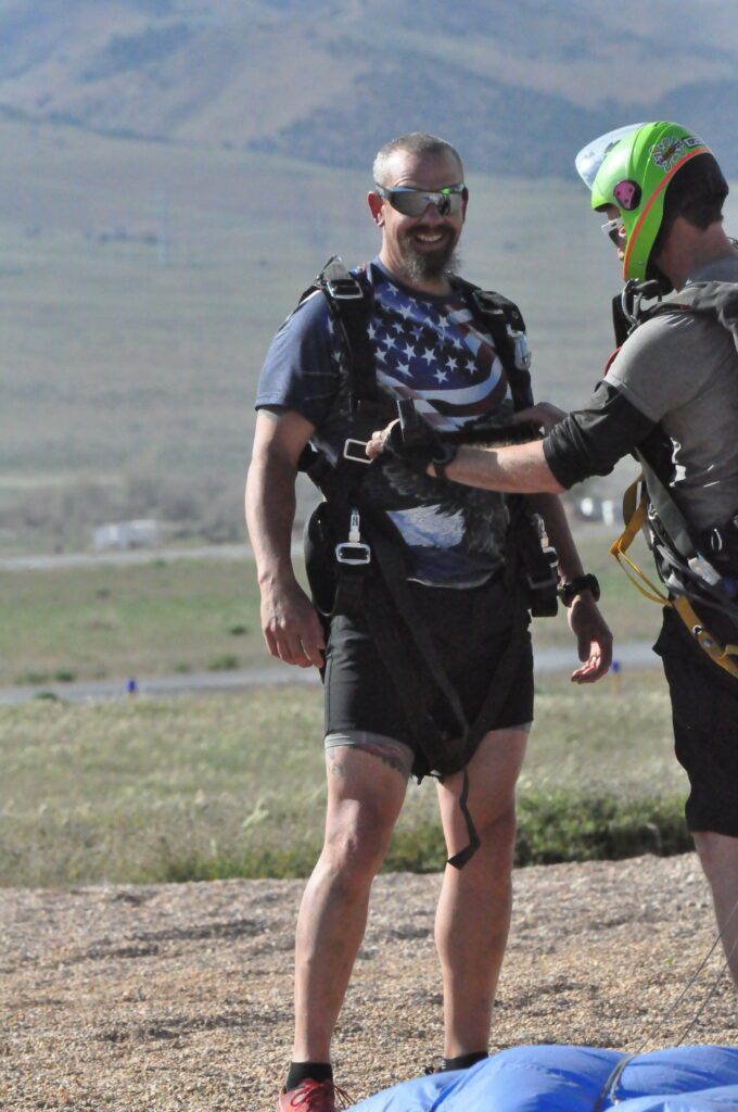 Addict II Athlete Rob Rich with parachute rigger